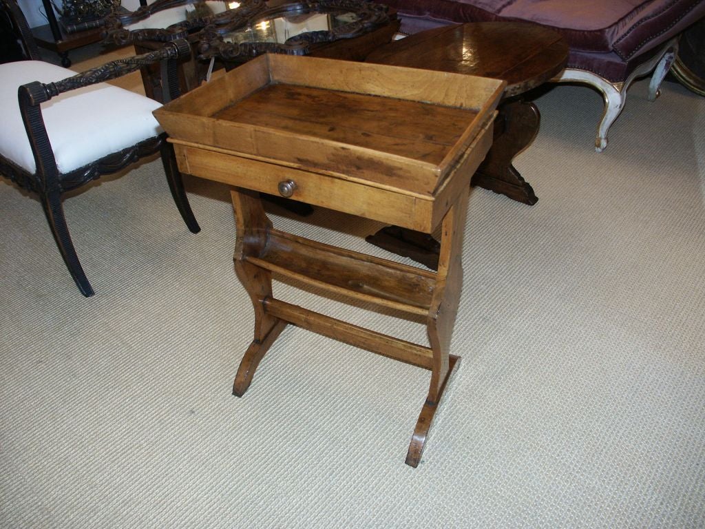 Wonderful antique table with great patina and lots of character.  This table was used originally for knitting.
