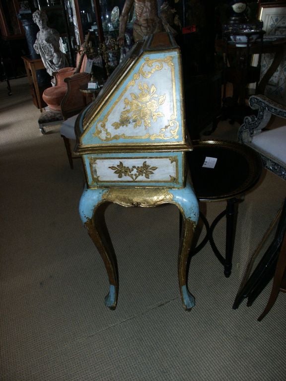 Stunning drop front secretary that is painted on all sides and is heavier than most Florentine furniture.
