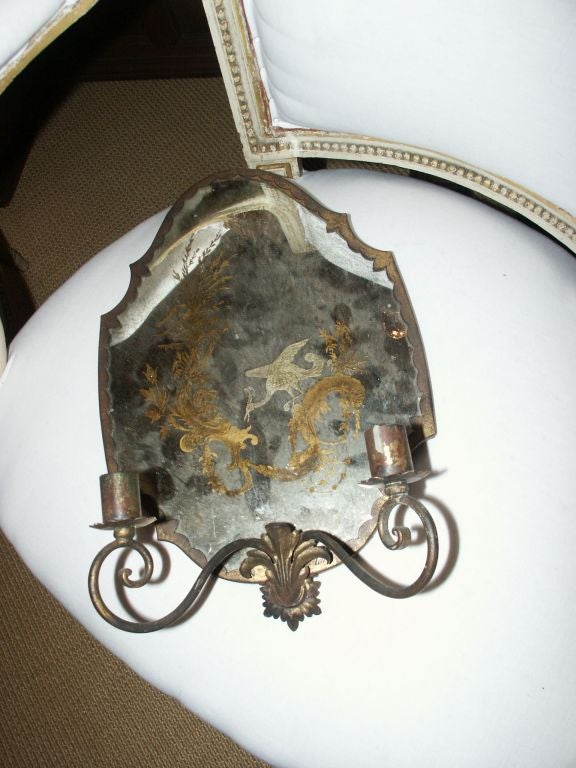 Great looking but as is on one of the mirrors wall sconces with gilt iron candle holders and eglomise decoration