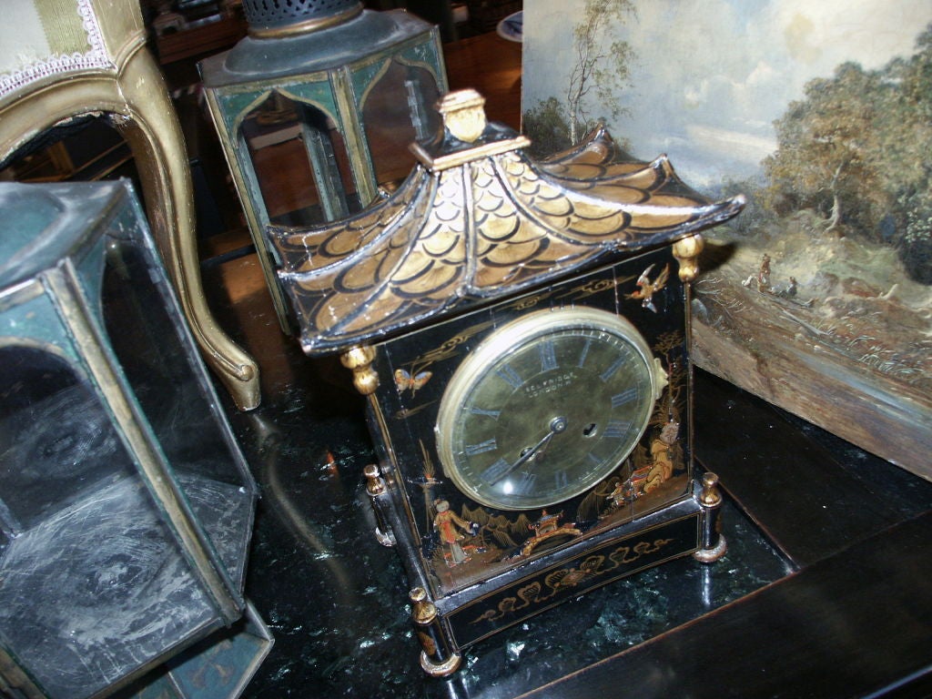 Charming Black Chinoiserie Clock Belfridge London is on the face along with French Made.