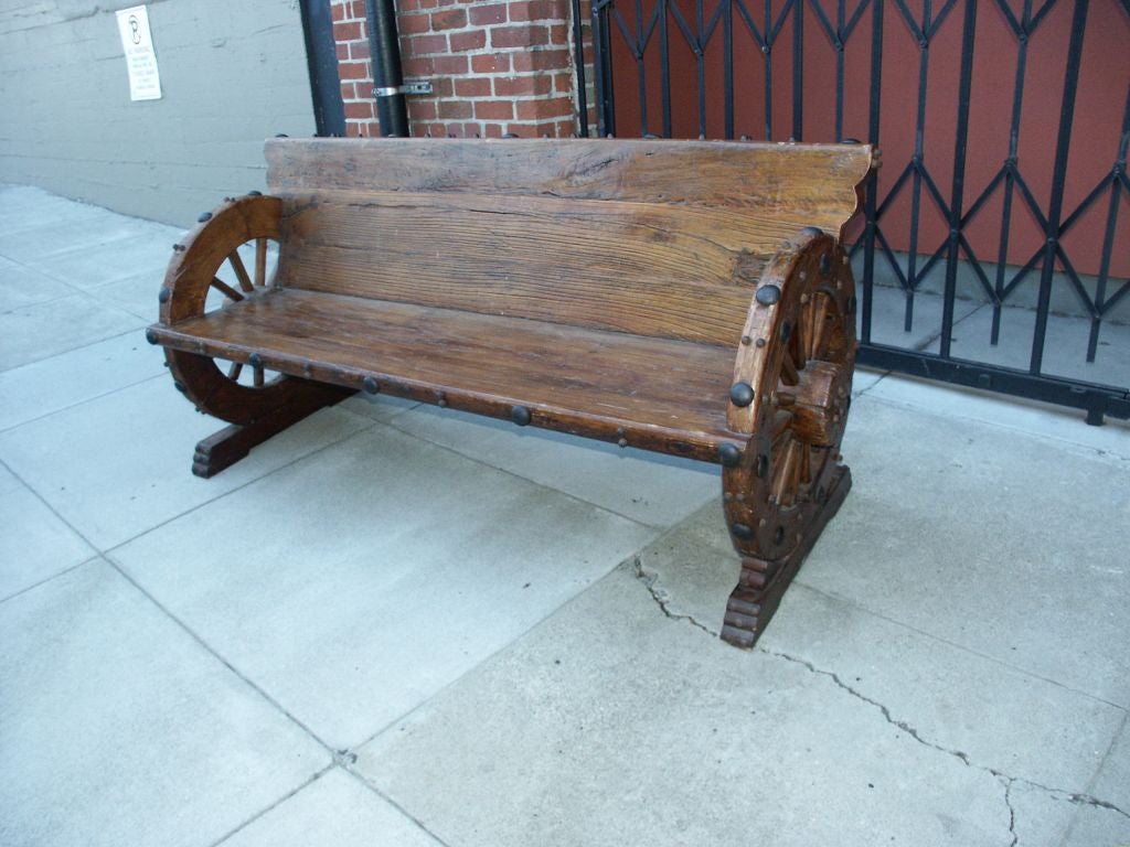 Unusual well made three Piece Set Two Benches and Table, with wagon wheel design  and brass studs and large tacks.  Great for western style home  inside or outside patio