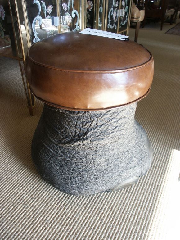 Very real looking fiberglass elephant foot stool with leather cushion