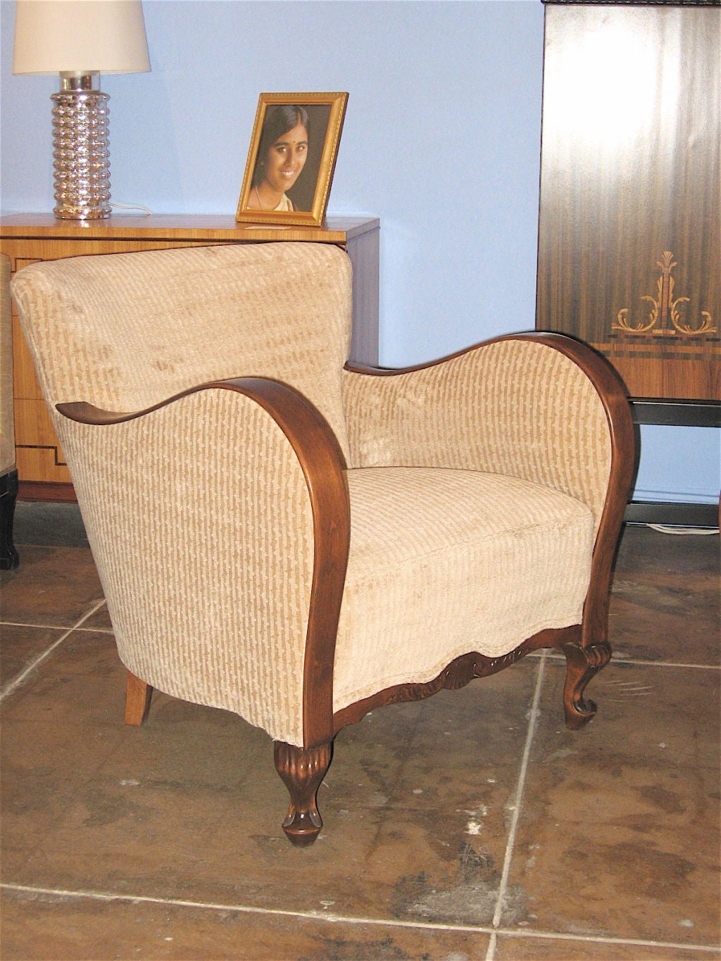 Pair of Swedish art moderne chairs in birch with curved arms and carved detail on the feet and the center of the seat rail.