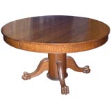 An American circular dining/breakfast table with extra leaves