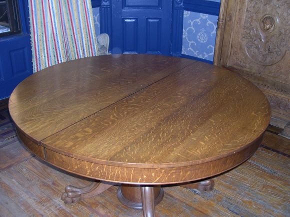 An American circular dining/breakfast table with extra leaves