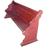 A 19th century red-painted bench