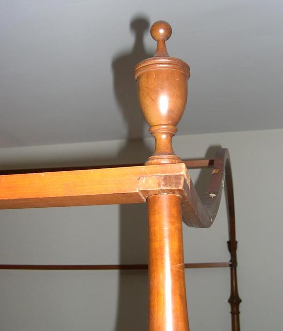 Each support with urn-shaped finial