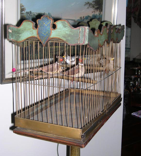 A Venetian Style Green-painted Bird Cage with Faux Birds