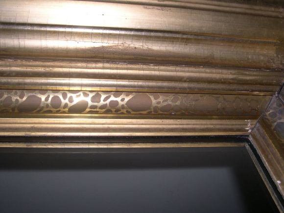 A gilt-wood rectangular mirror
