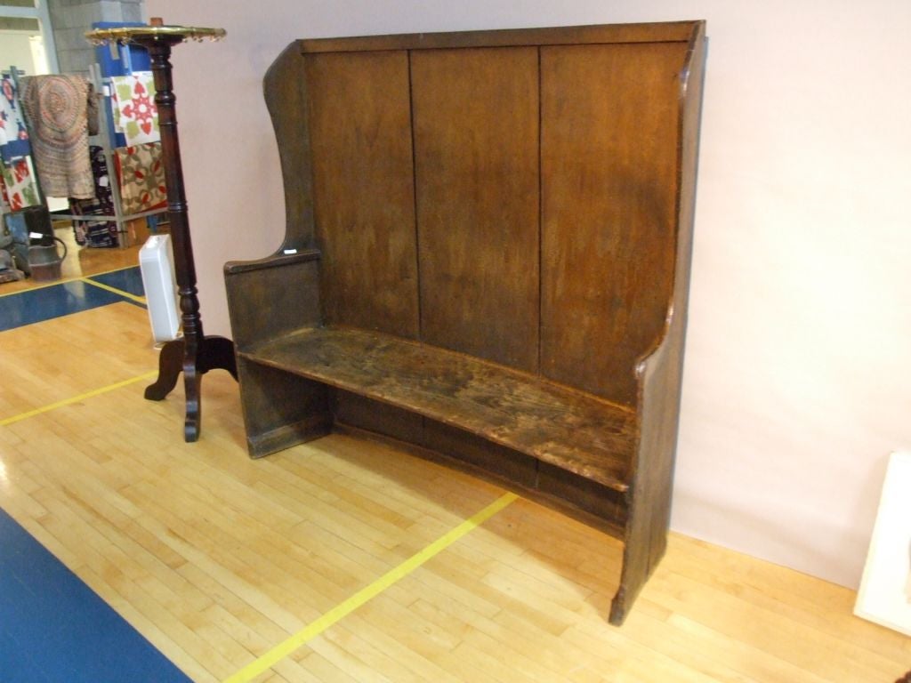 English 19th C West Country painted pine and oak settle with shaped plank sides fitted with interior turned arm-rests and wonderful single-baord elm seat.  Great form, retaining its historic surface.