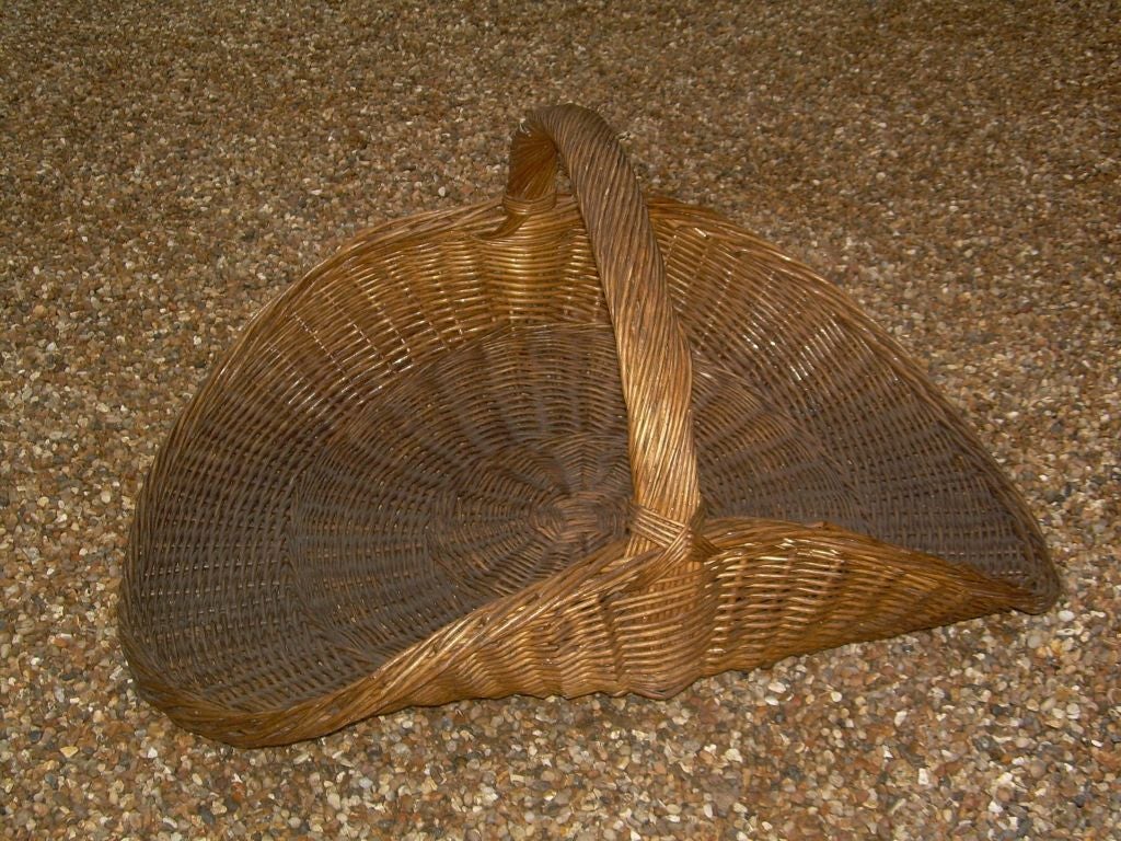 A 19th c. English Overscale Wicker Log Basket 1
