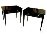 Pair ebonized side tables on brass castors