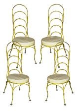 A set four faux-bamboo iron chairs