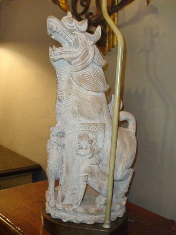 A pair of hand-carved dragon lamps