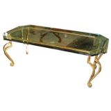 Gilt-Iron, glass-top coffee table on whimsical scrolled legs