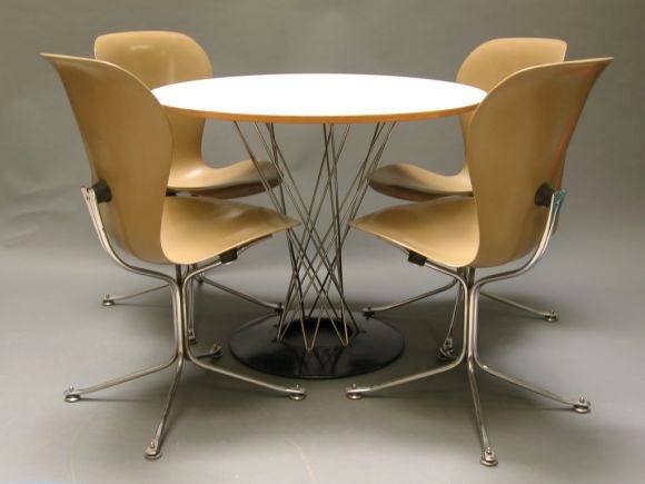 Cyclone Table paired with four Gideon Cramer designed 