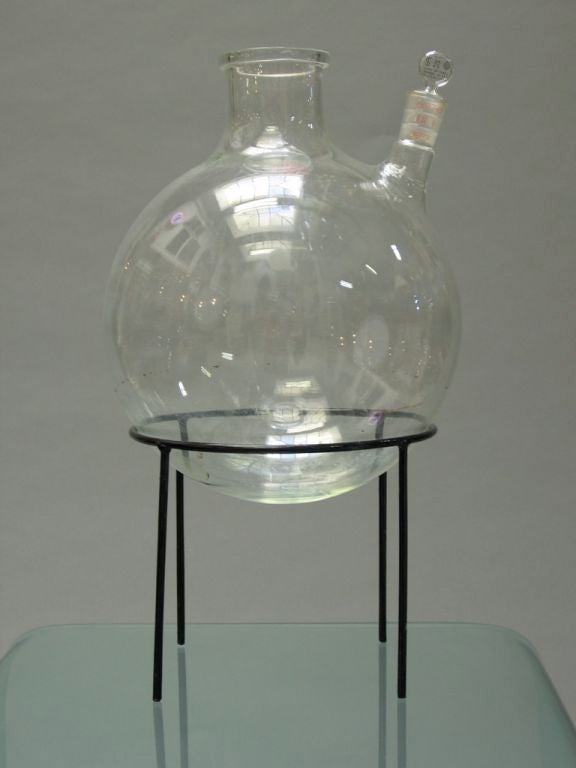 Hard to find, vintage, large sized glass bottles from laboratory on original stand. Fantastic flower vase or centerpiece when half filled with water. Great look (crank lab chic), retains original glass stopper for side spout. Priced separately: