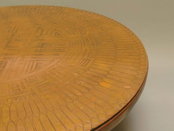 Made by Metropolitan furniture, this table features an imported Italian copper top etched with abstract disign. Original patina, could be polished if desired.