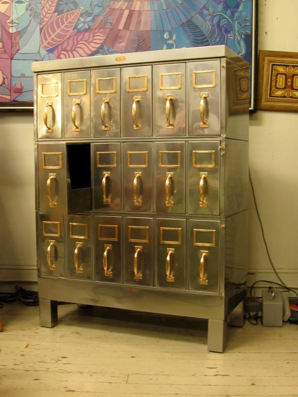 Early (for metal) office file with unusual modular side loading file configuration. Each section locks individually.  Polished and sealed with automotive laquer.