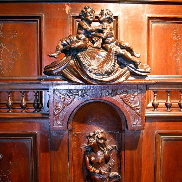 Carved bed with headboard and footboard.