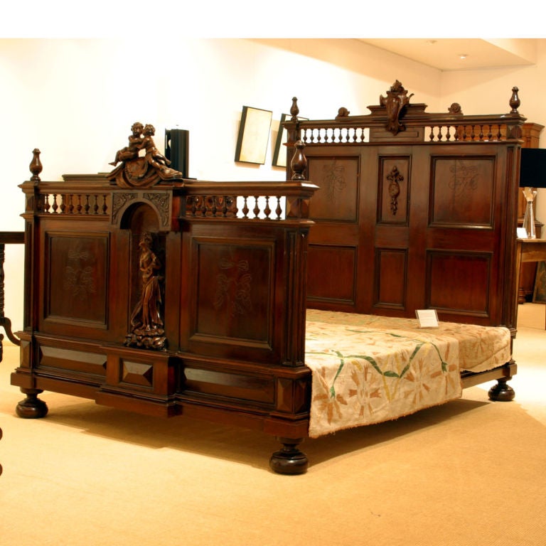19th Century Carved bed with headboard and footboard. For Sale