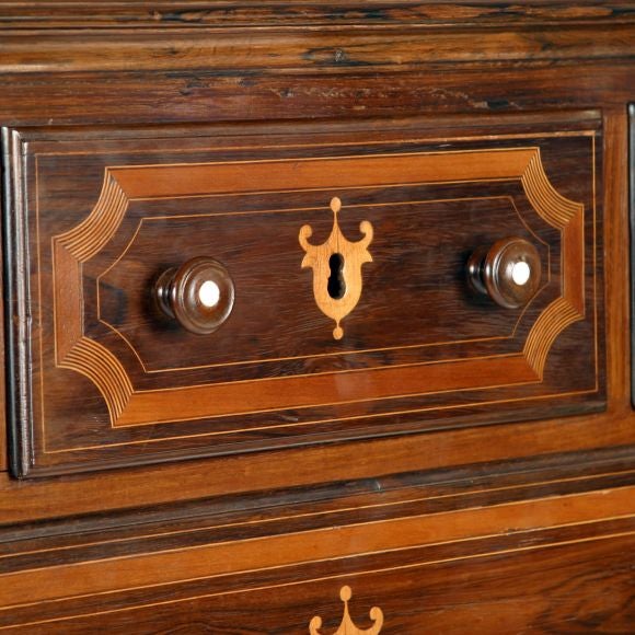 Early 19th C exceptional Imperial chest of drawers in well figured Jacarandá (Brazilian Rosewood) with highly decorative light wood stringing and banding. Original pulls with ivory inlay. From the Imperial family of Bourbon de Orleans e Bragança.<br