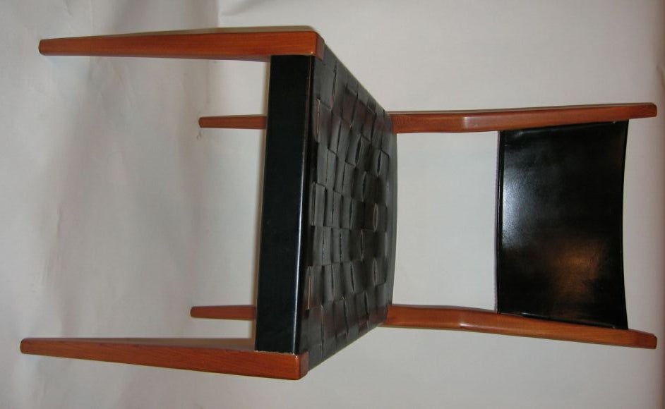 Woven black leather seat and leather backrest on walnut frame