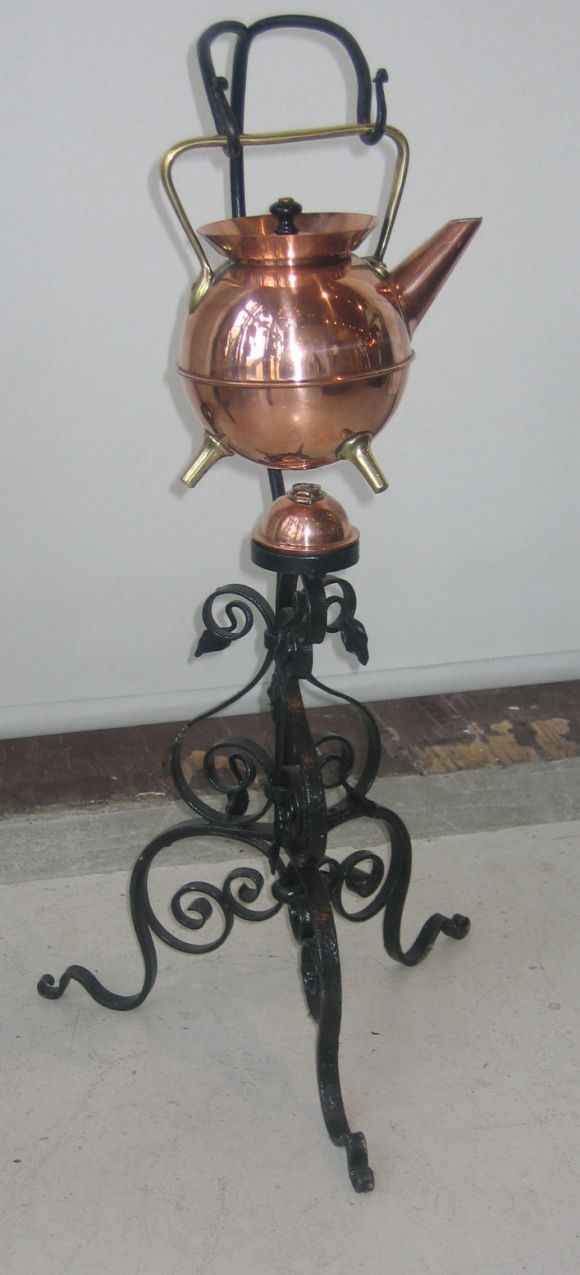 Stunning example of Victorian Modernism. Classic dresser teapot in copper and brass with ebonized lid handle, from Benham Froud (unmarked), on wrought iron stand with chafing lamp.