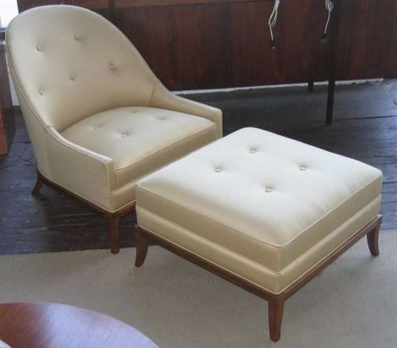 Beautiful spoon-back slipper chair and matching ottoman on elegantly articulated walnut legs.  Generously proportioned seat and ottoman make for luxurious sitting.  Reupholstered in a satiny caramel/gold Donghia wool.  Widdicomb labels.  Ottoman is