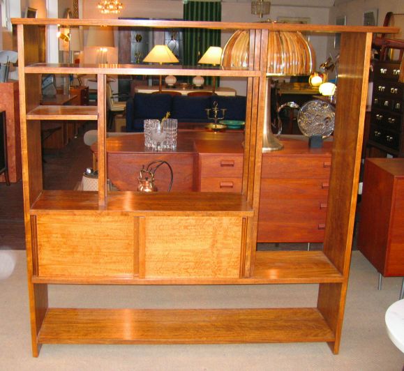 Gorgeous and rare Nakashima fixed-shelf display case in  Carpathian Elm and Black Walnut burl veneers. Finished on both sides,with two-sided sliding door storage area, this versatile bookcase can divide a room or stand against a wall. Angled