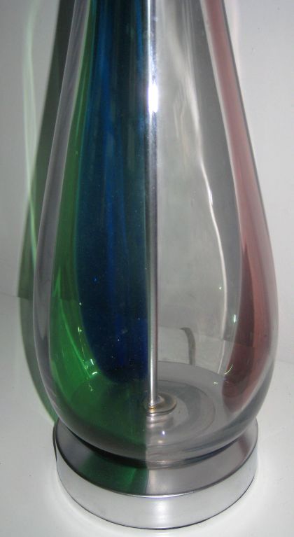 Tall gourd-shaped blown glass with swirling bands of color. On brushed nickel base, with nickel hardware.