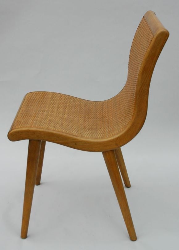 Set of Six curvaceous oak frame dining chairs with woven rattan backs. Matching dining table and buffet also available. Designed by Jack Van der Molen for Jamestown Lounge Co., Americana Casual line.