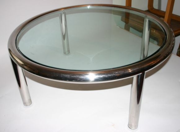 Thick chrome tube frame round table with 1/2 inch glass top.