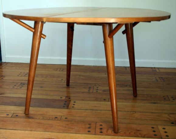 Round table with 6 Windsor-style chairs designed by Russel Wright for Conant Ball.<br />
Two leaves -- each 12