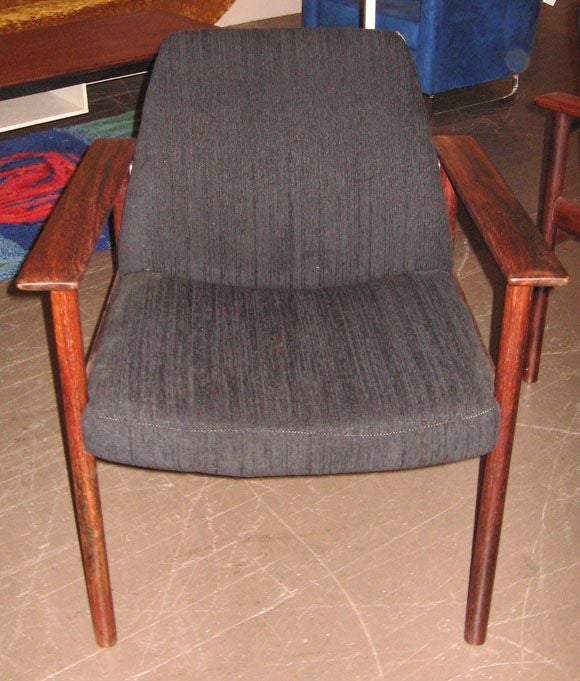 Pair solid rosewood armchairs in black cotton upholstery.