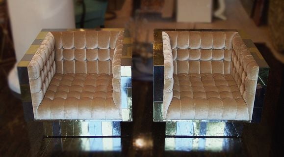 A beautiful signed pair of Paul Evans cube club chairs on swivel pedestal bases. Patchwork design mostly in chrome with scattered gold (brass) squares. Upholstery redone in pale gold silk velvet in original tufted design. Very comfortable, best of