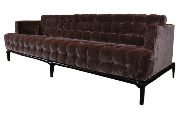 Beautiful biscuit tufted sofa by Maurice Bailey for Monteverdi Young. Newly reupholstered in 100% silk velvet.  Exquisitely sculpted ebonized mahogany base with tapered legs.