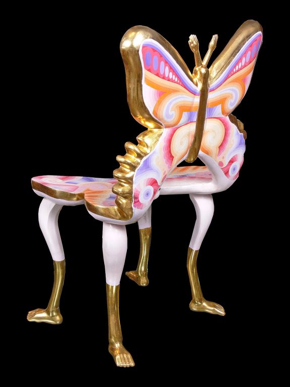 Spectacular butterfly form chair by Pedro Friedeberg. Exuberantly hand painted in hues of violet, pink and orange. Pale violet legs end in gilded feet. With gilt trim edges and detailing. Signed twice “Pedro Friedeberg”.