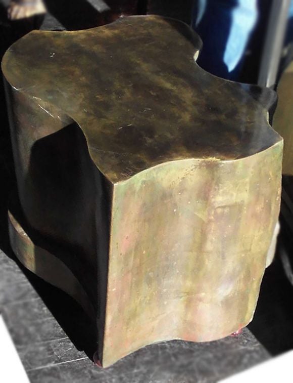 A rare amorphic bronze table in polished bronze by Kelvin LaVerne, signed. Features a raised abstract figural relief on one side with three figures.  Can take glass top or use without.