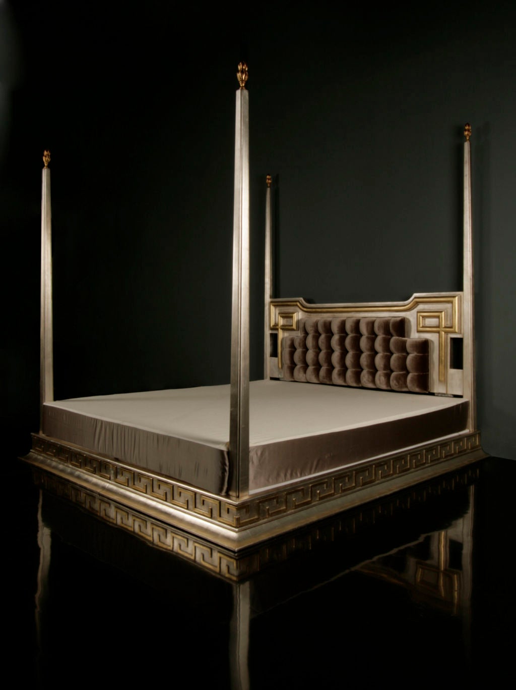 Important King-Size Four Poster Bed by James Mont,<br />
Includes a pierced carved grey silk velvet upholstered headboard both with silver leaf finish, each post decorated with gilded and carved flame finials. The entire bed rests on a platform