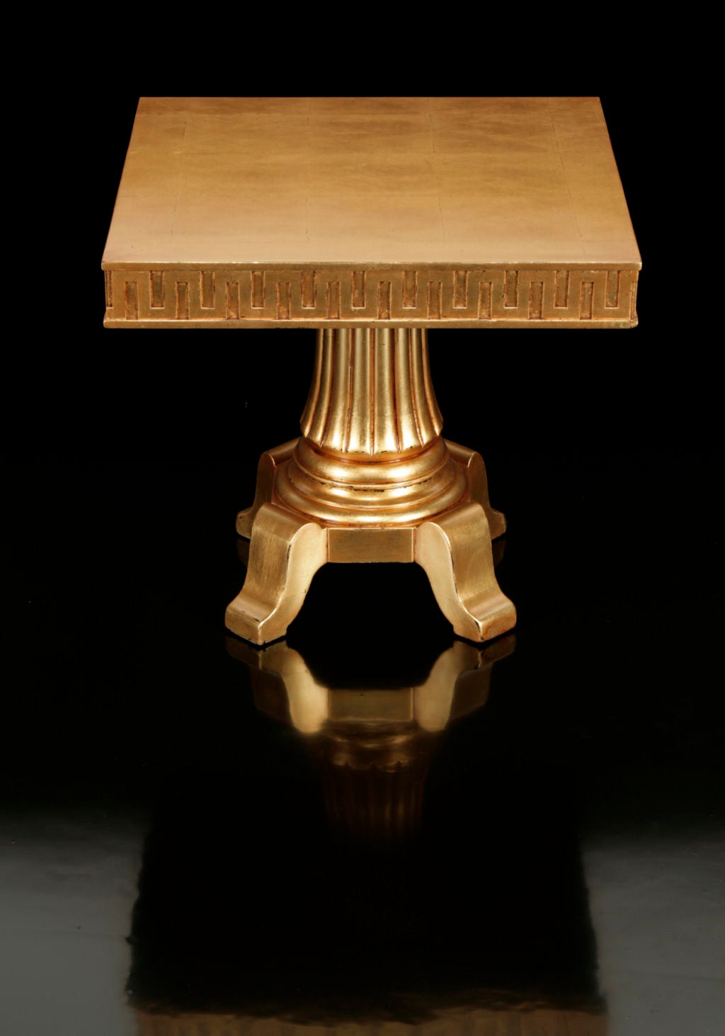 Gilt low table by James Mont.

Square top decorated with chinoiserie fretwork carved apron on a fluted column base, finished in antiqued gold metal leaf as shown in concept drawing. Listed on Mont’s contract specifications provided by Mont to Mr.