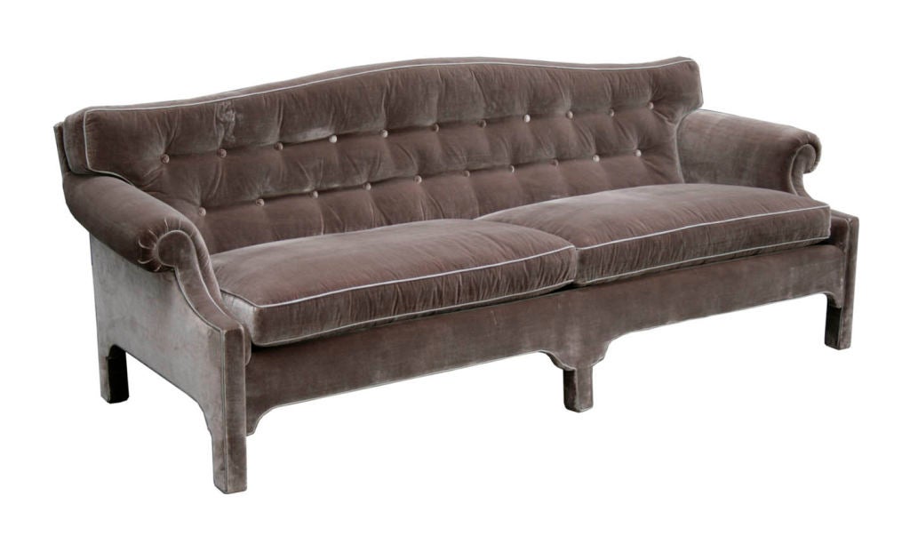 Classic Hollywood regency style sofa in silk velvet. Elegant, modern Chinese Chippendale styling with a tufted back and two loose cushions. Fully upholstered frame with silk satin piping.
