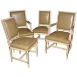 A Set of Four Directoire Style Parcel-Gilt Cream Painted Chairs