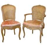 A Set of 12 Louis XV Style Cream Painted Chairs