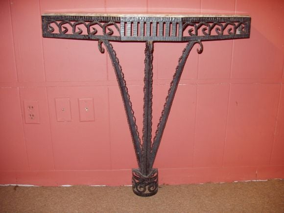 An Art Deco Patinated Wrought Iron Console and Mirror