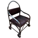 INDUSTRIAL AGE IRON CHAIR ON ROLLERS