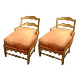 A PAIR OF FRENCH COUNTRY SHORT CHAISES LOUNGES