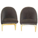 A pair of mid-century slipper chairs by Theo Ruth
