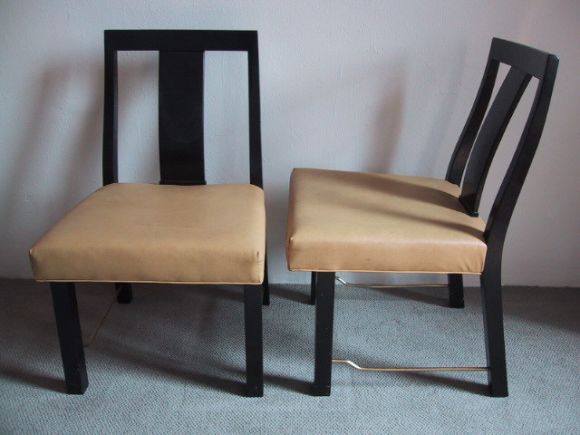 A set of six Edward Wormley for Dunbar Asian style dining chairs in mahogany with brass stretchers. Two arms and four sides.