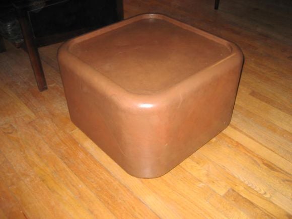 A leather covered occasional table.